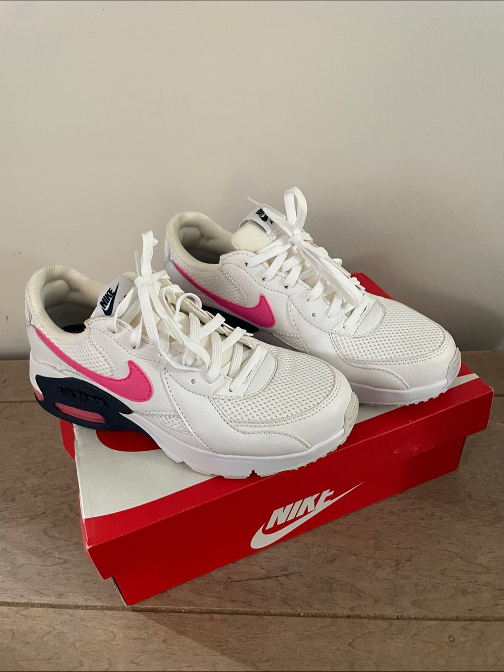 Nike White Sneakers with Pink Swoosh and Navy Accents